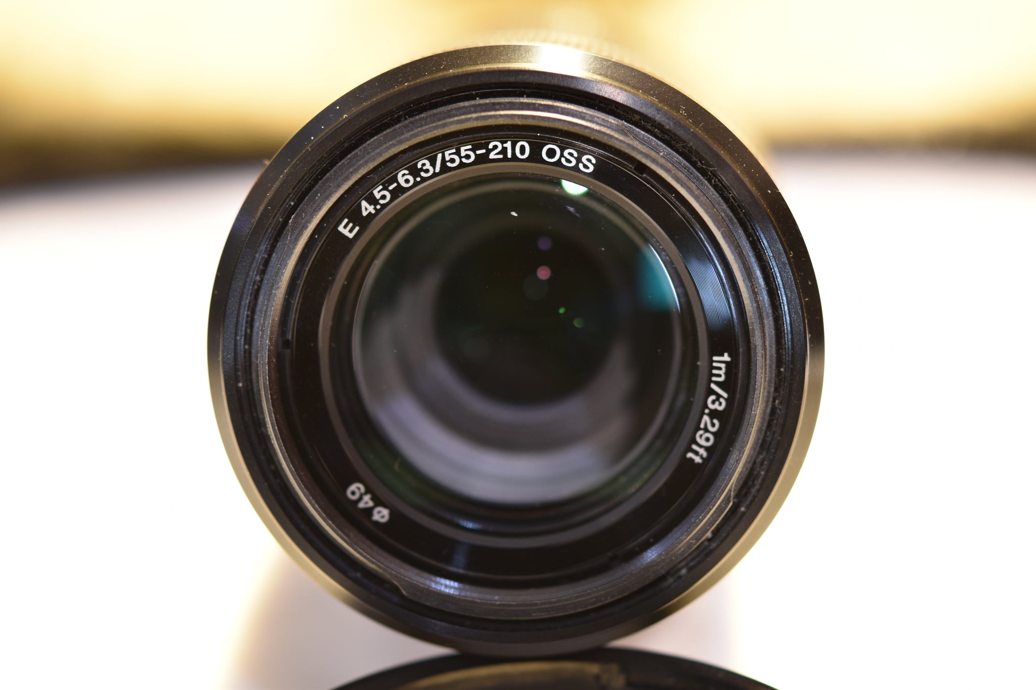 thumbnail interactive-video image 1 of USED] Sony SEL 55-210mm F/4.5-6.3 OSS E-Mount Lens  Silver  With Marumi 49mm Lens Filter S N 2670017 Near New Condition P 32779 1 of 14