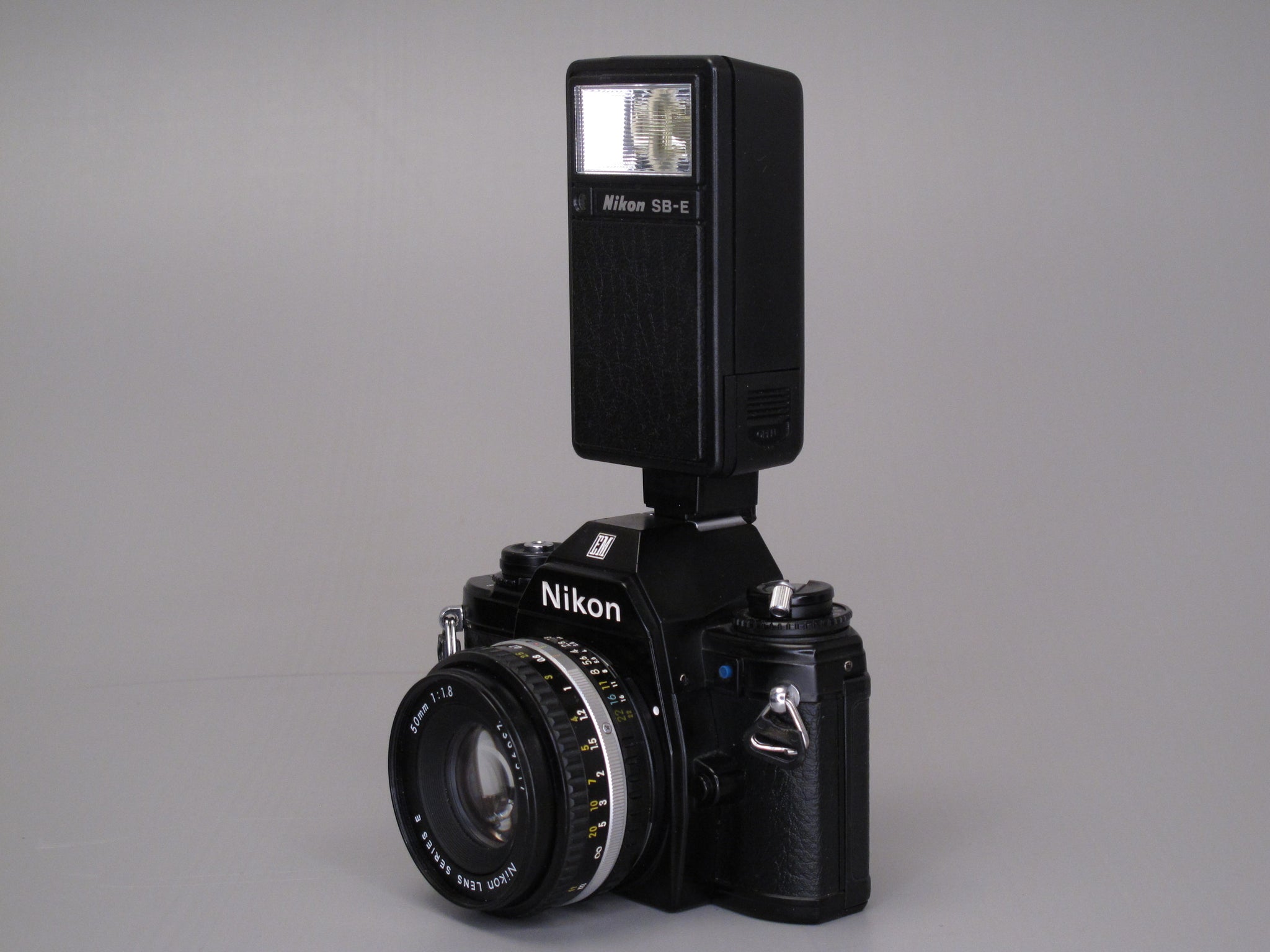 Nikon EM Camera with 50mm f1.8 lens and Flash – Phototek Canada