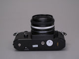 Nikon EM Camera with 50mm f1.8 lens and Flash